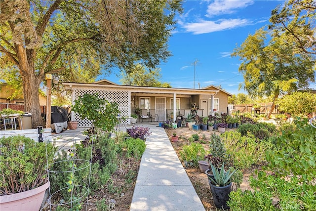 bungalow featuring a patio