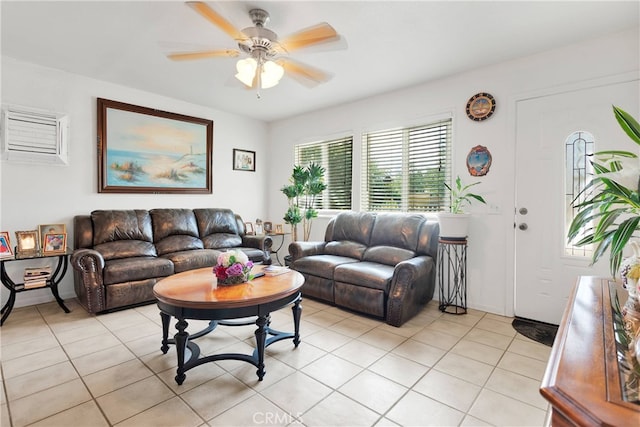 living room with ceiling fan and light tile patterned flooring