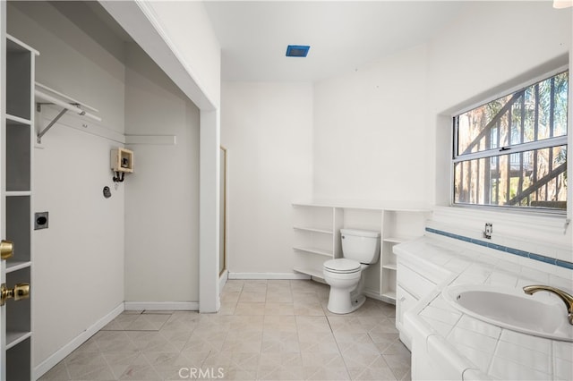 bathroom with vanity, toilet, and a shower with shower door