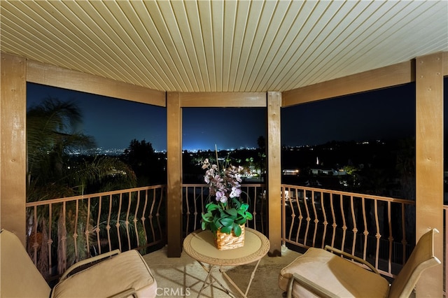 view of balcony at twilight