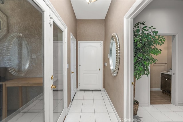 hallway featuring light tile patterned flooring