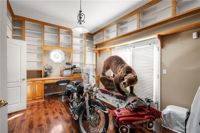 miscellaneous room featuring dark wood-style floors and built in study area