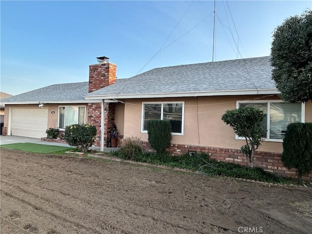 ranch-style home featuring a garage