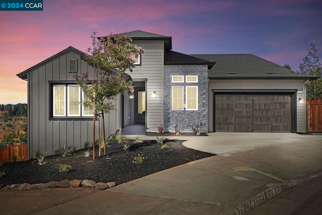 view of front of property with a garage