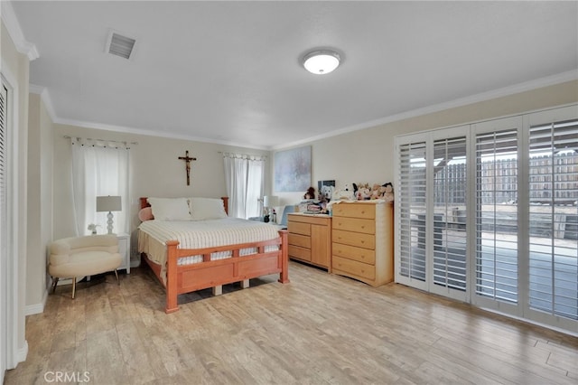 bedroom with access to exterior, light hardwood / wood-style floors, and crown molding