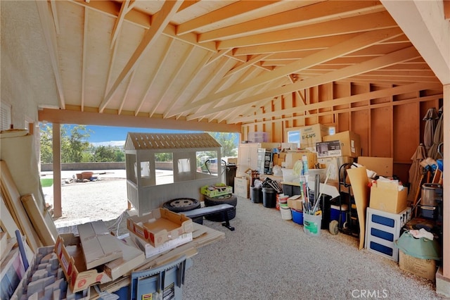 misc room with lofted ceiling and carpet floors