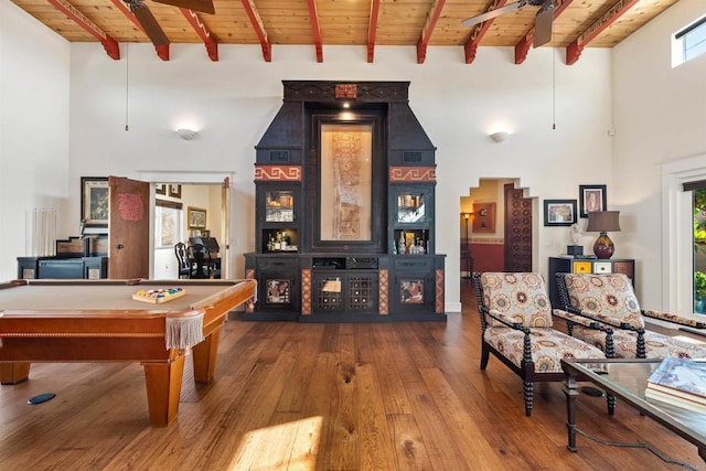 game room with wood ceiling, pool table, ceiling fan, beam ceiling, and hardwood / wood-style floors