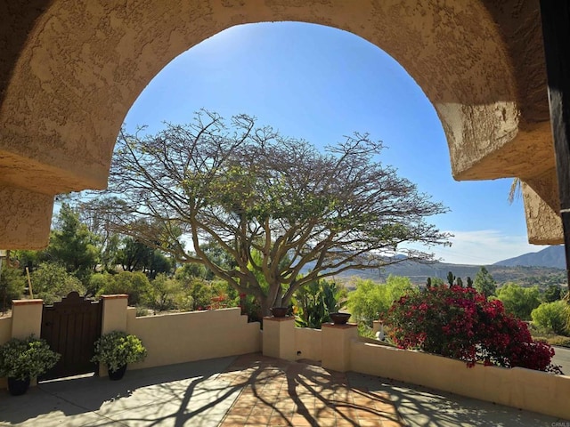 view of patio / terrace with a mountain view