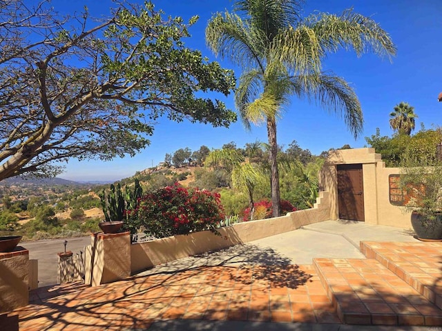 view of patio / terrace featuring a mountain view