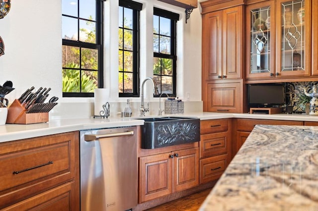 kitchen with dishwasher, sink, and dark wood-type flooring