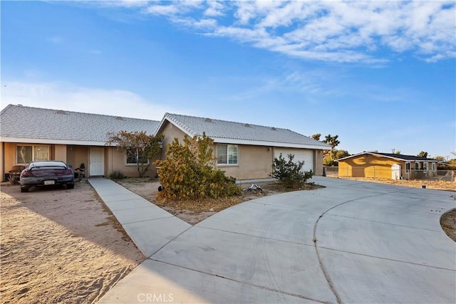 ranch-style house featuring a garage