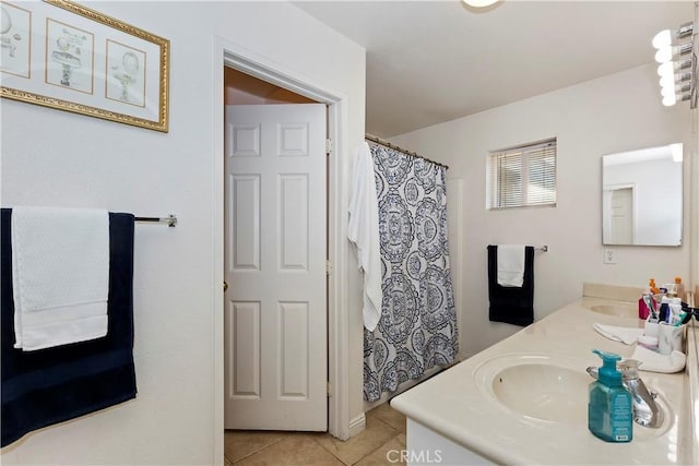 bathroom with tile patterned flooring and vanity