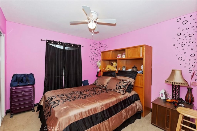 bedroom with light carpet and ceiling fan