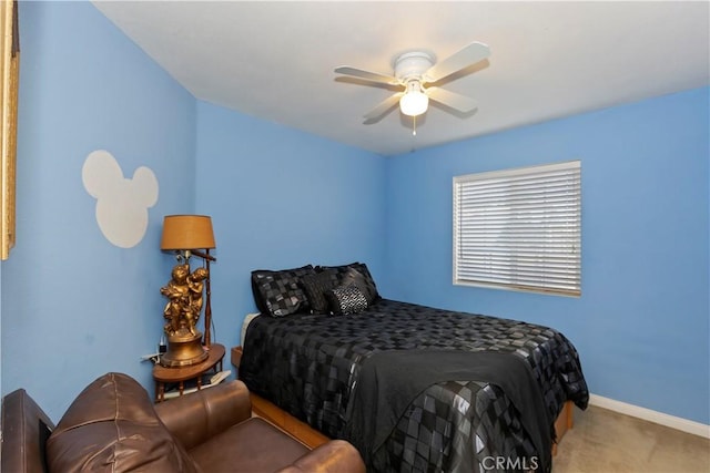 bedroom featuring ceiling fan and carpet