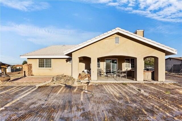 rear view of house with a patio area