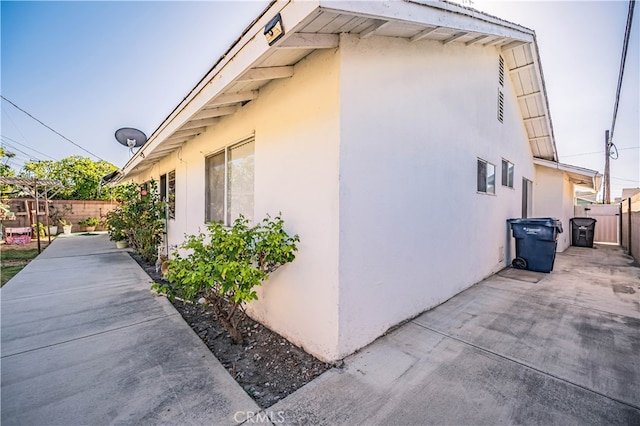 view of side of home featuring a patio area