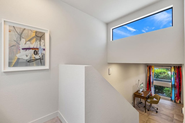 stairway with tile patterned flooring