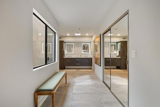 corridor with light tile patterned flooring