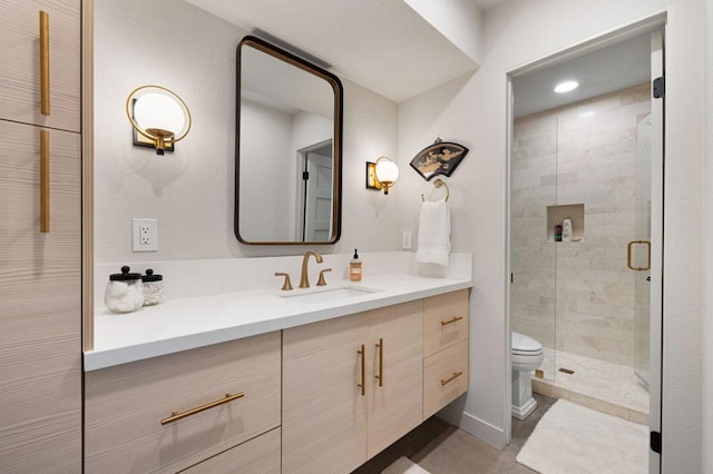 bathroom featuring tile patterned flooring, vanity, toilet, and a shower with door