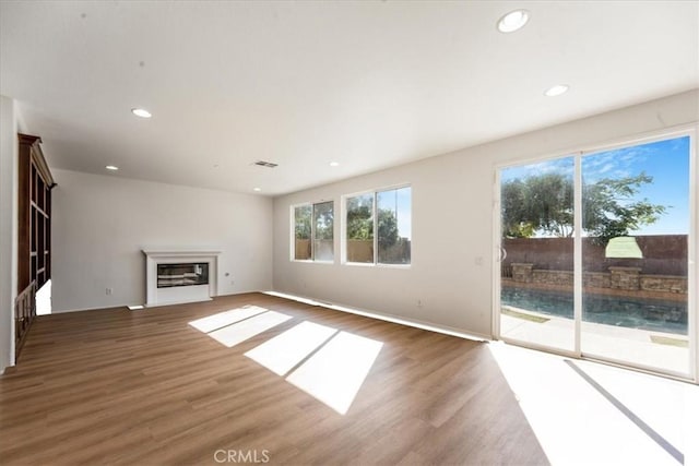 unfurnished living room featuring dark wood-type flooring