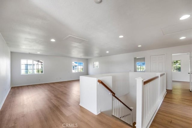 corridor with light hardwood / wood-style flooring