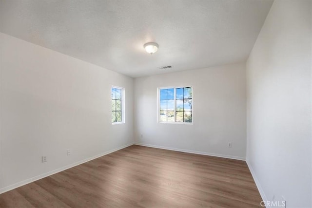 empty room featuring hardwood / wood-style flooring