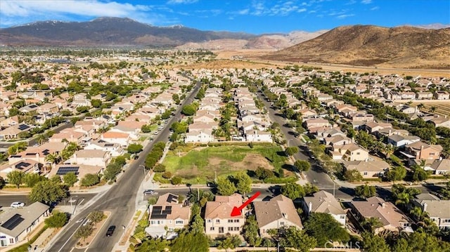 birds eye view of property featuring a mountain view