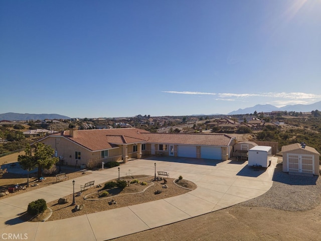 view of front of house featuring a mountain view and a garage