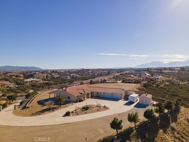 birds eye view of property featuring a mountain view