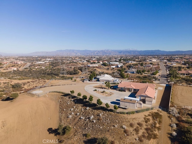 birds eye view of property featuring a mountain view