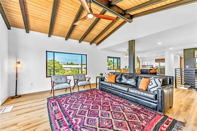 living room with vaulted ceiling with beams, ceiling fan with notable chandelier, wood ceiling, and light hardwood / wood-style floors