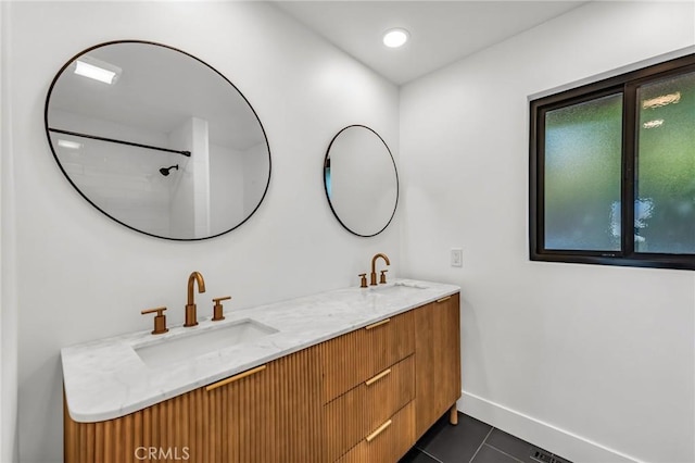 bathroom featuring tile patterned floors and vanity