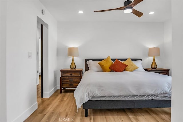 bedroom featuring hardwood / wood-style floors and ceiling fan