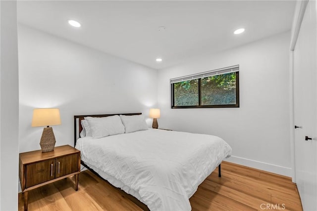 bedroom featuring wood-type flooring