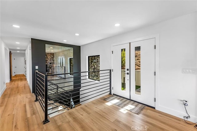 foyer featuring french doors and light wood-type flooring