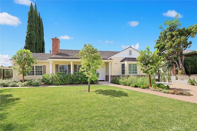 ranch-style home featuring a front yard