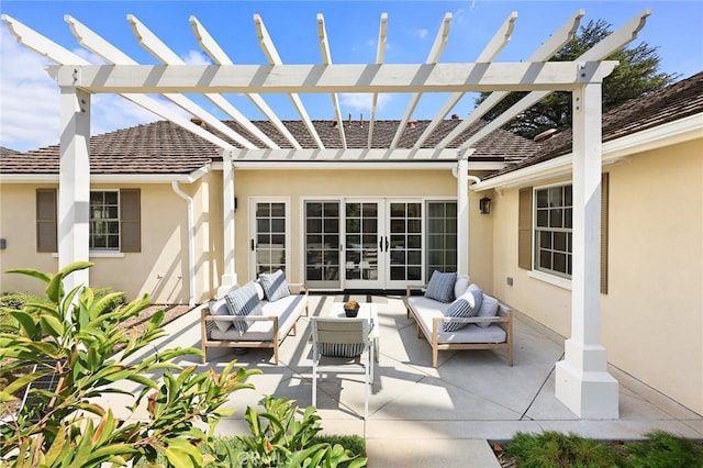 view of patio / terrace with an outdoor living space, a pergola, and french doors