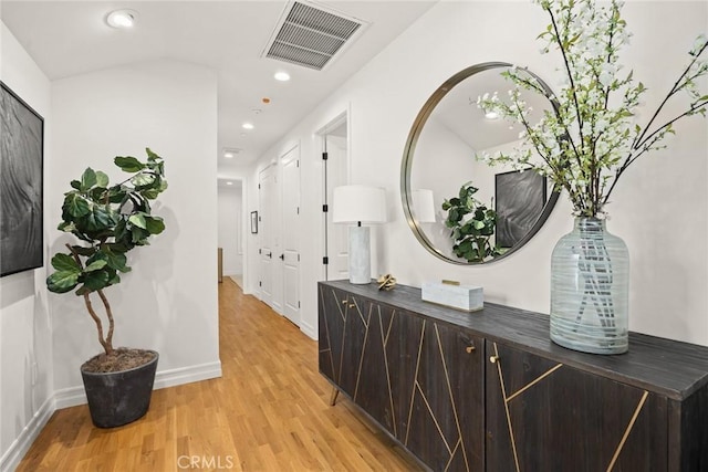 hall with light hardwood / wood-style flooring