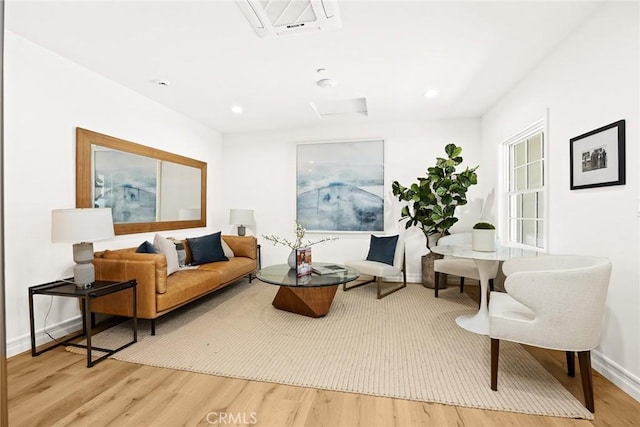 living area with hardwood / wood-style floors