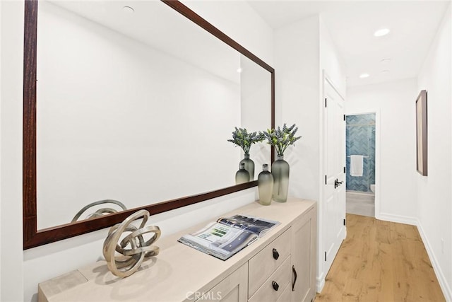 corridor featuring light hardwood / wood-style flooring