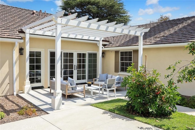 view of patio with a pergola, outdoor lounge area, and french doors