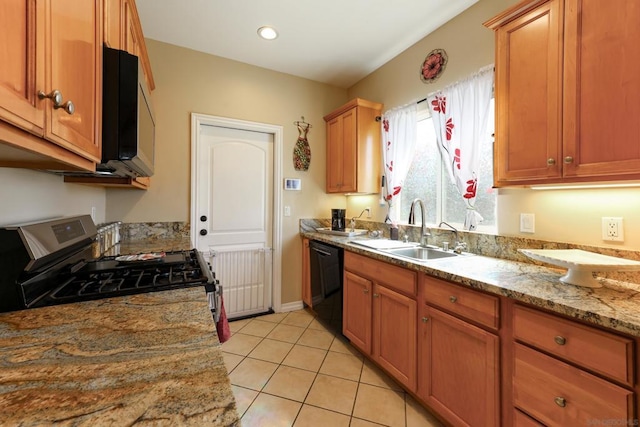 kitchen featuring light stone countertops, sink, light tile patterned floors, black dishwasher, and stainless steel range with gas cooktop