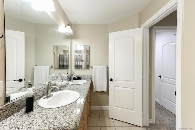 bathroom featuring tile patterned flooring and vanity