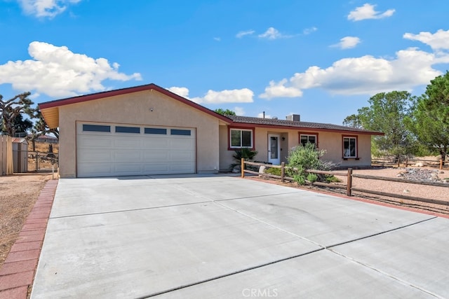 ranch-style home with a garage