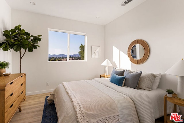 bedroom featuring light wood-type flooring