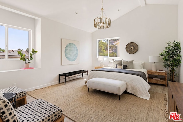 bedroom with hardwood / wood-style flooring, lofted ceiling with beams, and a notable chandelier