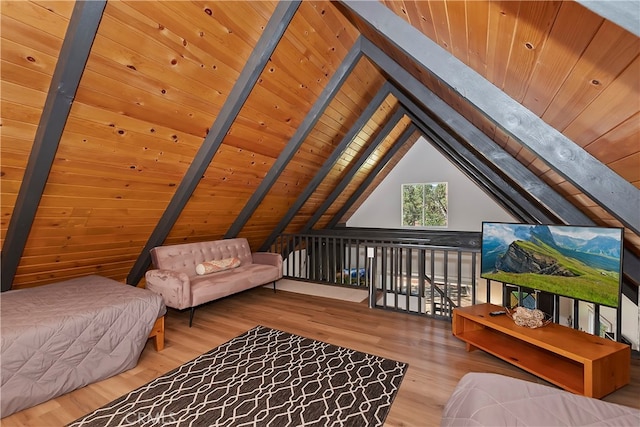 bedroom featuring wood-type flooring, vaulted ceiling with beams, and wooden ceiling