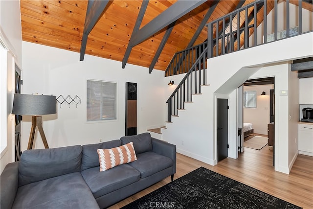 living room with wooden ceiling, light hardwood / wood-style floors, beamed ceiling, and high vaulted ceiling