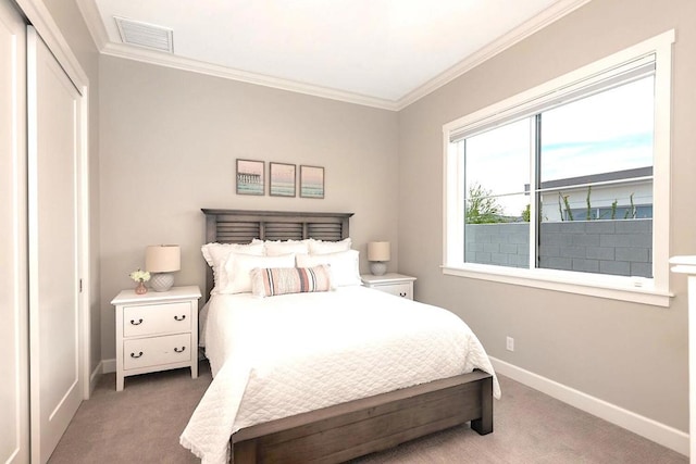 bedroom featuring carpet floors and crown molding