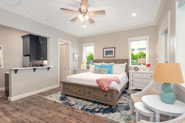 bedroom featuring ceiling fan, a closet, dark hardwood / wood-style floors, and crown molding